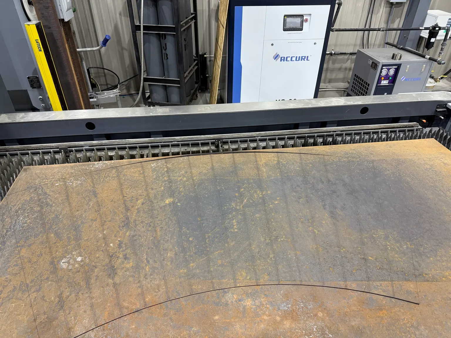 Approximately three-eighth-inch steel plate cut on the ACCURL laser table