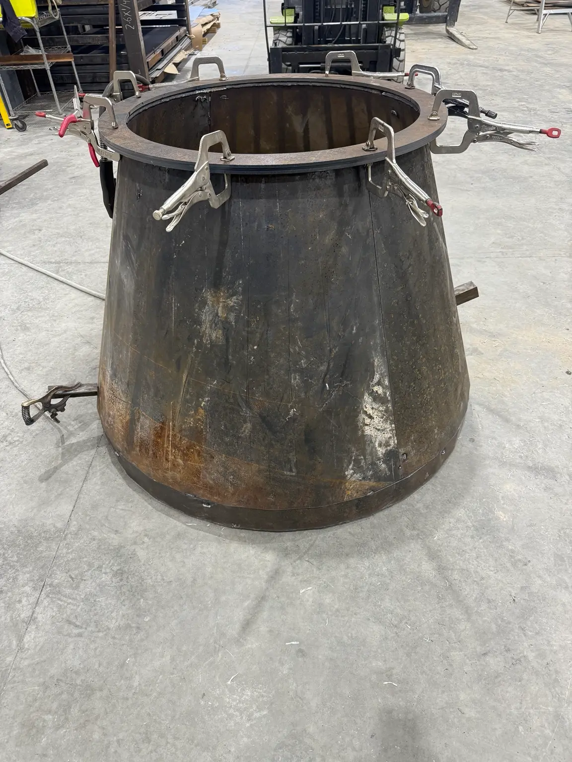 Fabricated steel cone during ring fit-up with clamps
