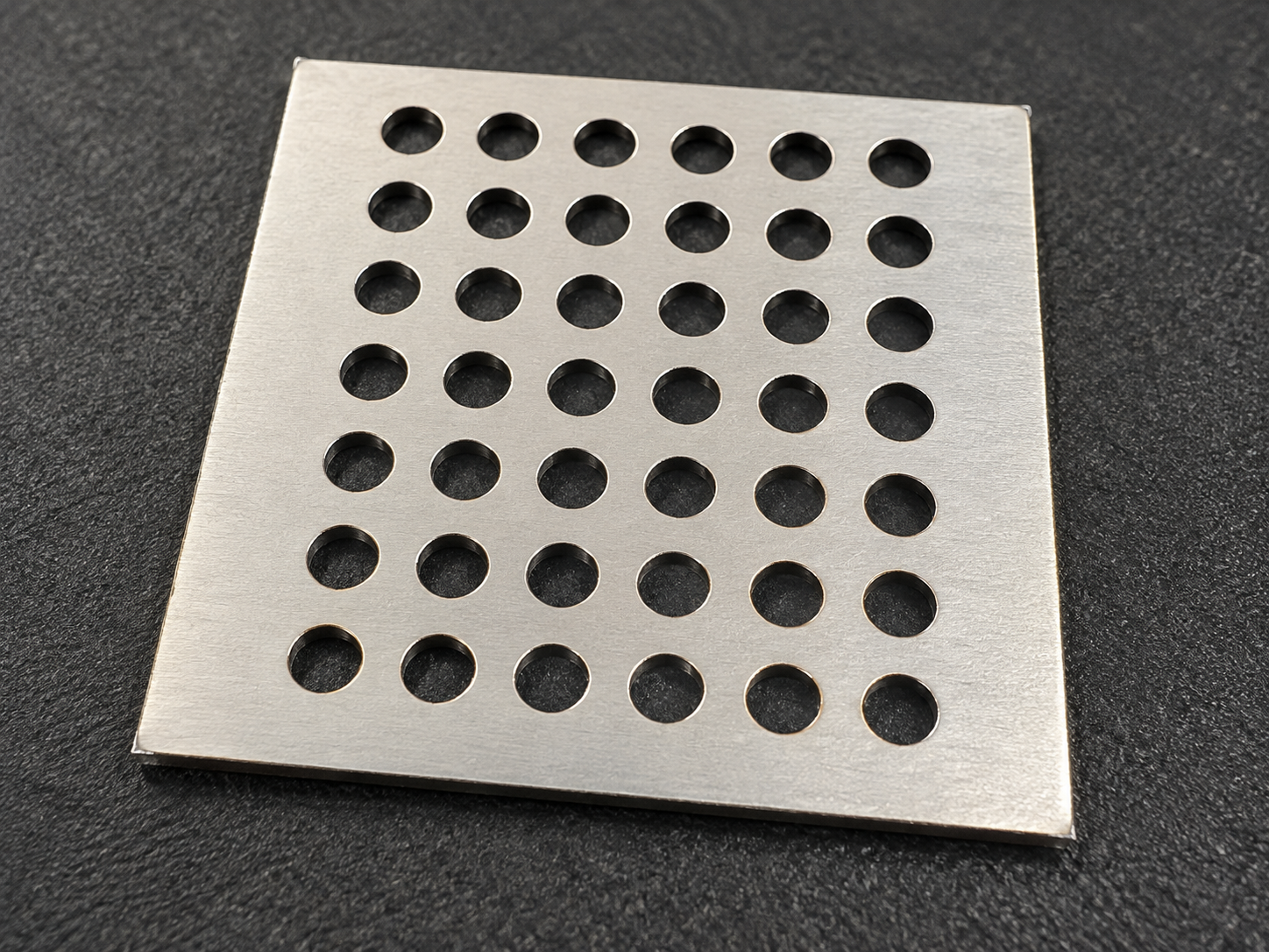 Steel plate with repeated clean round holes